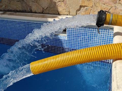 Pool filling with a tanker truck in Son Ferriol, Palma